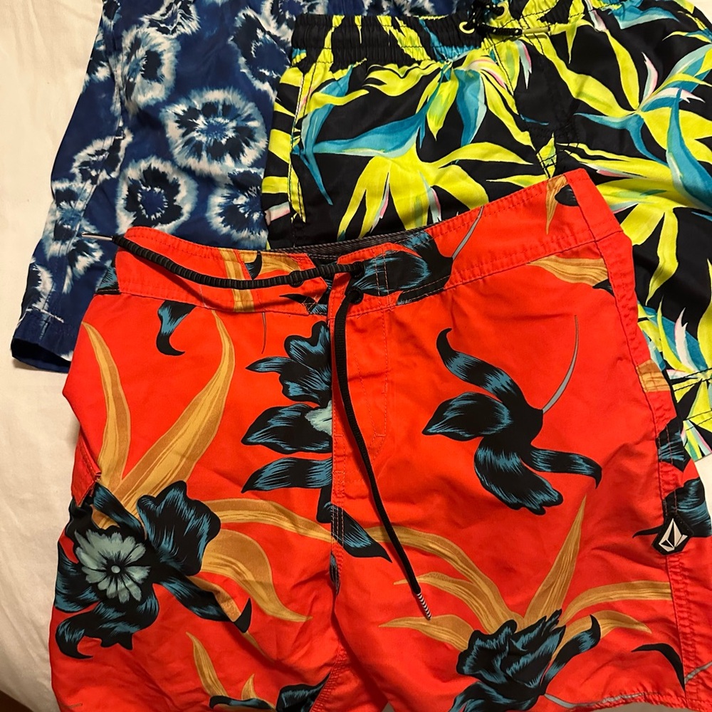Bundle of boys swim trunks (3) and rash guards (2)